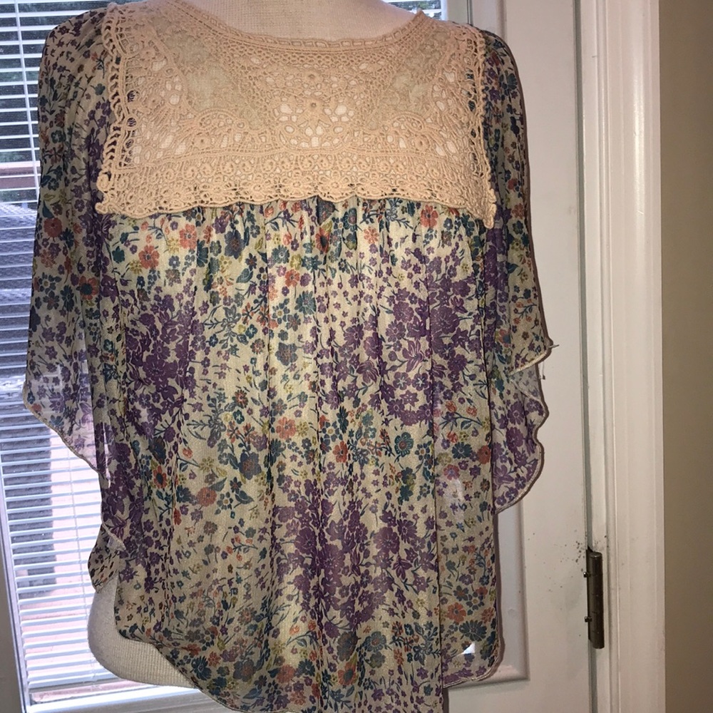 Butterfly style floral blouse with knit front.